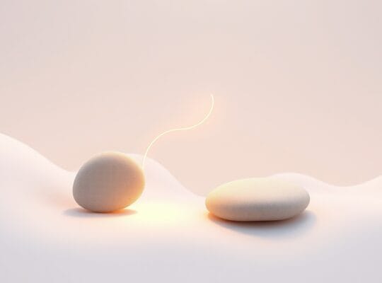 Delikatne, abstrakcyjne formy splatają się, tworząc świetlistą nić ciepła i zaufania.